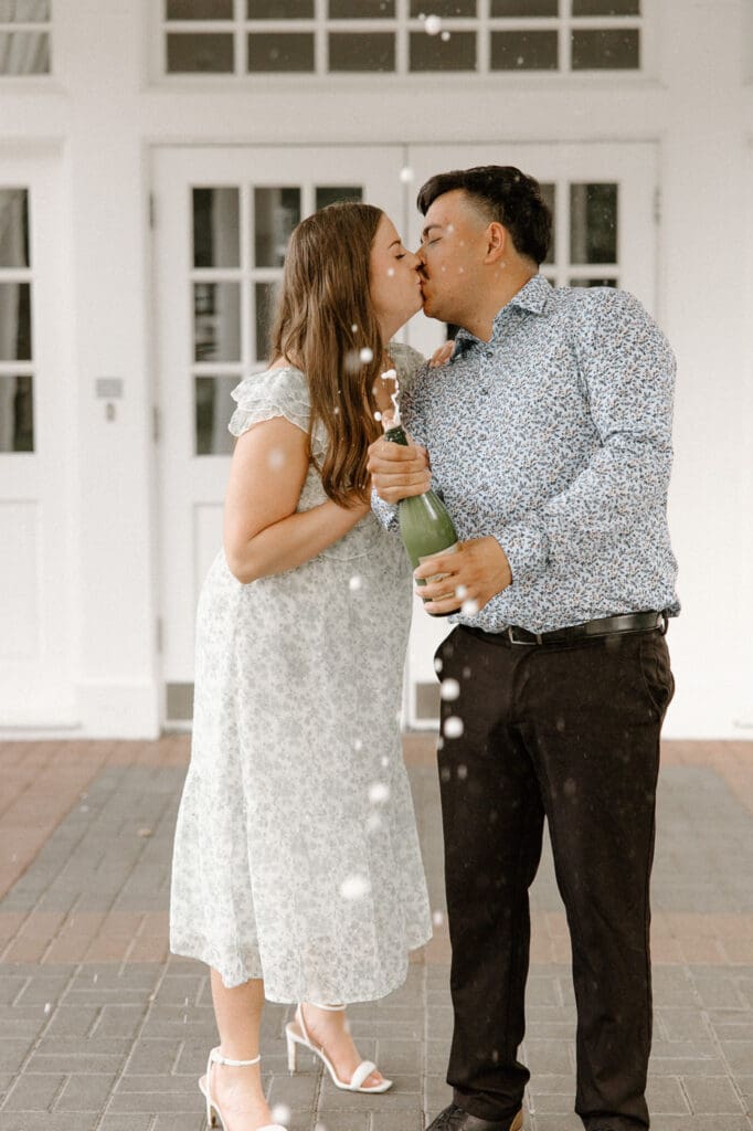 Arlington hall dallas engagement photos champange kissing