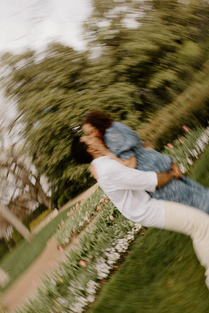 Dallas arboretum engagement photos spinning in field