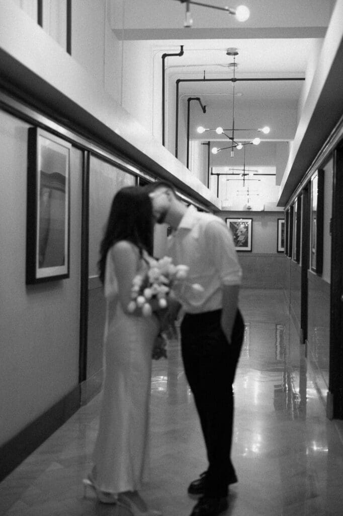 The kirby dallas engagement photos kissing hallway