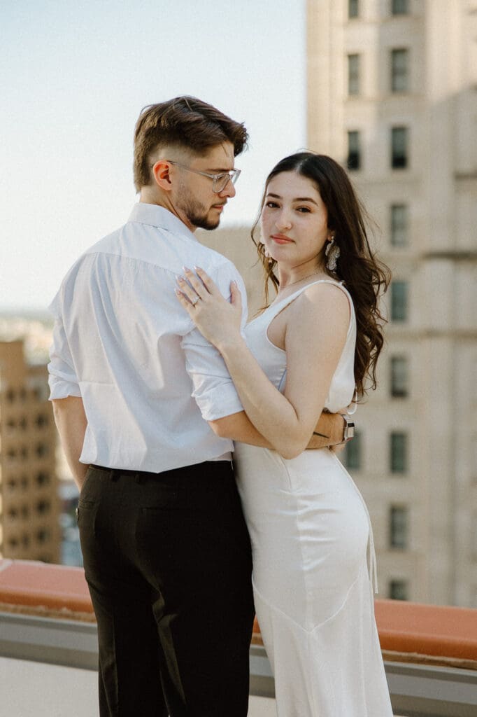 The kirby dallas engagement photos rooftop hugging