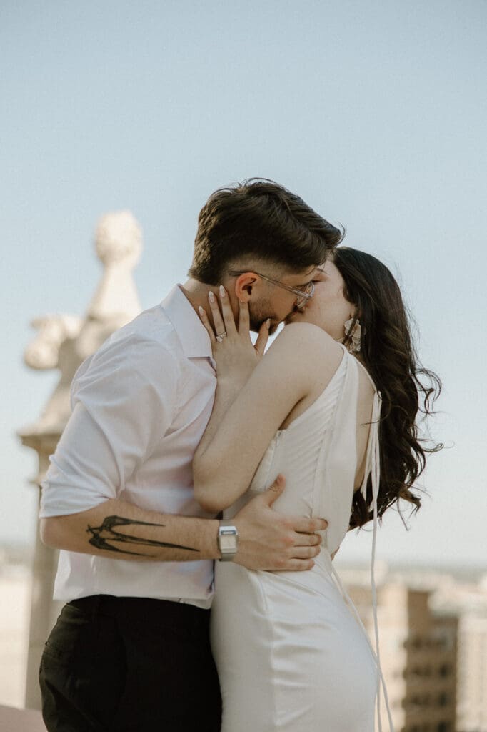 The kirby dallas engagement photos rooftop kissing
