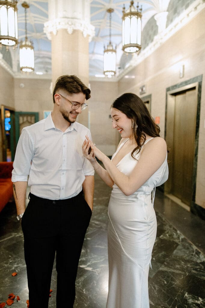 The kirby dallas engagement photos smiling at ring