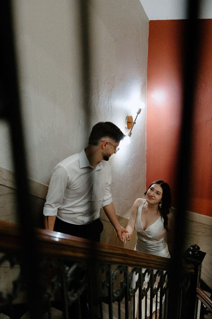 The kirby dallas engagement photos walking up stairs holding hands